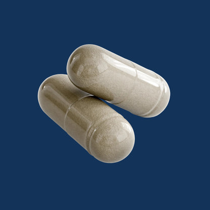 Two capsules of acai detox supplement on a blue background, promoting cleansing and digestive health.